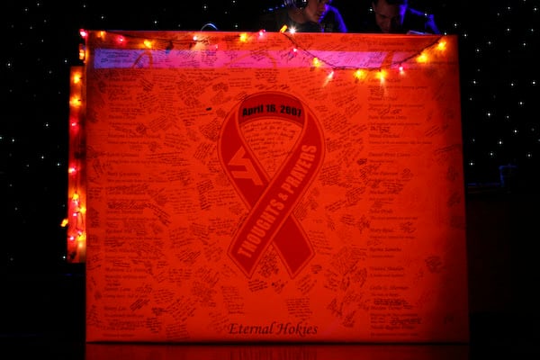 A signed April 16 memorial panel displayed at Maroon Effect