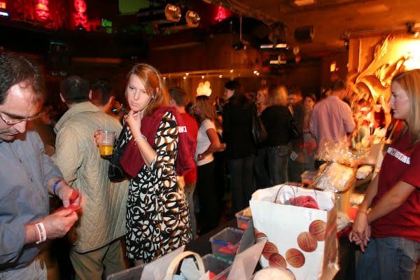 A wide view of the silent-auction area during Maroon Effect