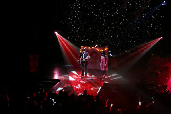 A performer addressing the room from the Webster Hall stage